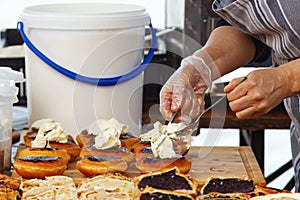 Closeup of chef making desserts at farmers market.
