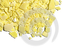 Closeup chemical ingredient on white laboratory table Top View. Sodium sulfide flakes, a yellow appearance owing to the presence