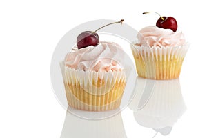 closeup of cherry buttercream cupcakes