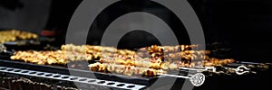 Closeup of Chicken kebab skewers on BBQ