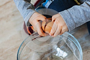 Closeup of a child breakable egg, on the floor in a glass bowl.