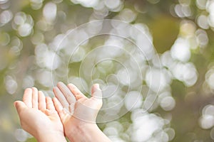 Closeup of child open two empty hands with palms up for pray to God