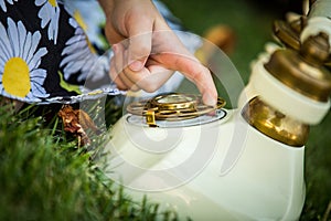 Closeup of child`s hand dialing on an antique telephone