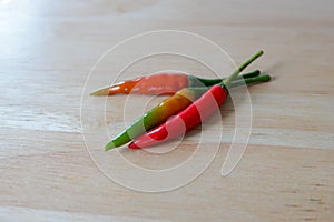 Closeup chilli Padi or bird chili, Thai pepper on chopping board