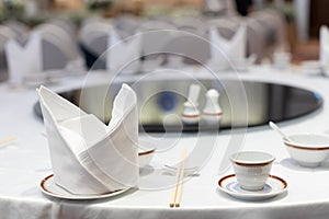 Closeup of Chinese dinner wedding table setting in a restaurant, selective focus