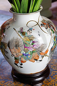 Closeup of the Chinese mountain warrior beautifully painted on the cermaic white vase