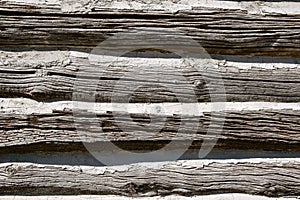 Closeup of  chinking on an old cabin wall