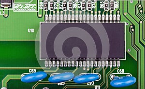 Closeup chip with space for your text on a green circuit board