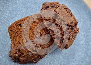 A closeup of a choc chip muffin on a plate