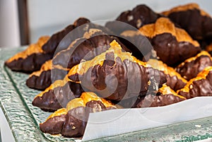 Closeup chocolate croissant on glass plate