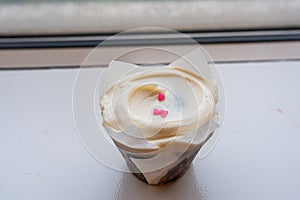 Closeup chocolate cupcake with a vanilla buttercream frosting