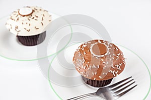 Closeup chocolate cupcake with white sprinkle and fork