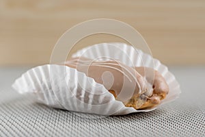 Closeup of chocolate eclair on grey background