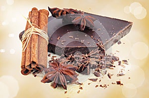 Closeup of chopped chocolate, cinnamon and anise