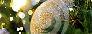 Closeup Christmas ball on Christmas tree with bokeh background for cover banner for social media or other background