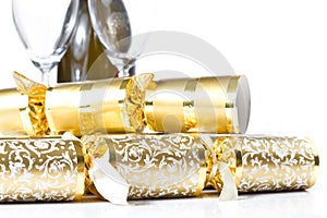 Closeup of christmas crackers and Champagne bottle