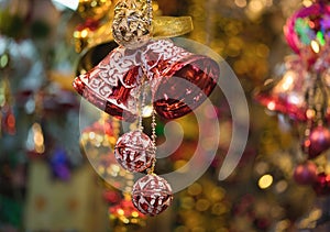 Closeup of Christmas holiday tree decorations with bokeh on background