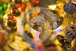 Closeup of Christmas holiday tree decorations with bokeh on background