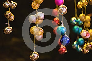 Closeup of Christmas holiday tree decorations with bokeh on background