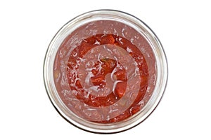 Closeup of a chunky salsa sauce in a glass jar