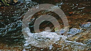 Closeup cinematic image of a rapid break in the rainforest jungle river at Amboro National Park, Bolivia photo