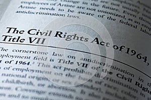 closeup of the Civil Rights Act of 1964 Title VII, printed in textbook on white page.