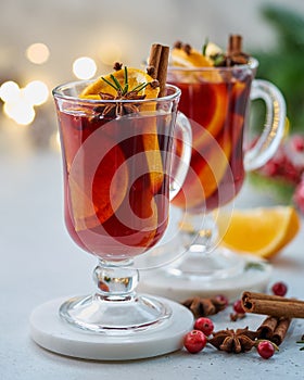 Closeup of claret red mulled wine on white coaster. Selective focus, blurred background, closeup