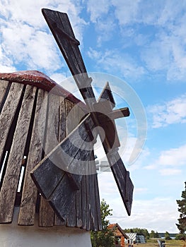 Closeup of classic wooden windmill with blades