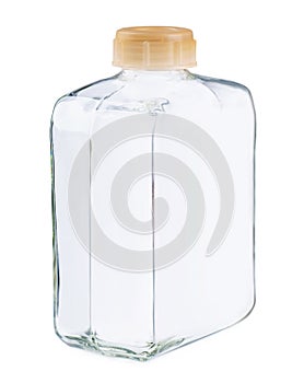 Closeup of a clear glass square bottle and no lable