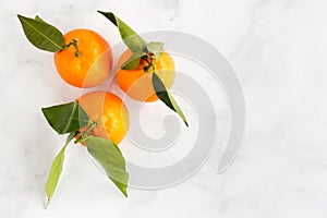 Closeup of Clementines on White Marble Background