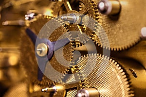 Closeup from a clockwork machinery, brassy gears