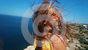 Closeup clow motion portrait beautiful smiling brunette woman with long wind blowing hair