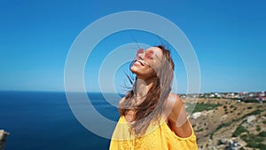 Closeup clow motion portrait beautiful smiling brunette woman with long wind blowing hair