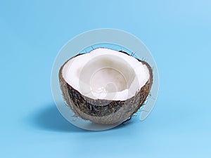 Closeup of coconut on blue background. Summer background