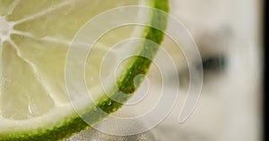 Closeup of coctail. Mojito, tonik water with mint and lemon and lime and ice cubes