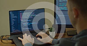 Closeup coding on screen, Man hands coding html and programming on screen Monitors, development web, developer.