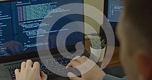 Closeup coding on screen, Man hands coding html and programming on screen Monitors, development web, developer.