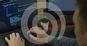Closeup coding on screen, Man hands coding html and programming on screen Monitors, development web, developer.