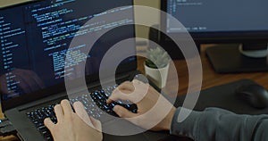 Closeup coding on screen, Man hands coding html and programming on screen Monitors, development web, developer.