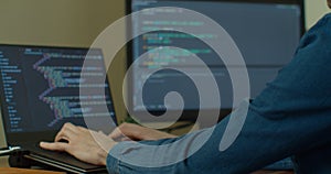 Closeup coding on screen, Man hands coding html and programming on screen Monitors, development web, developer.