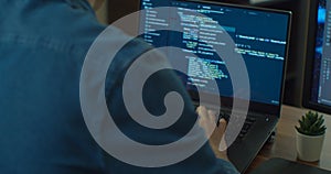 Closeup coding on screen, Man hands coding html and programming on two screen Monitors, development web, developer.