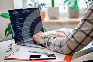 Closeup coding on screen, man`s hands coding and programming on screen laptop, development web, developer