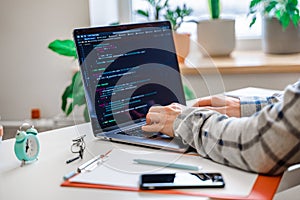 Closeup coding on screen, man`s hands coding and programming on screen laptop, development web, developer