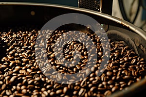 closeup of coffee beans tumbling in a roaster