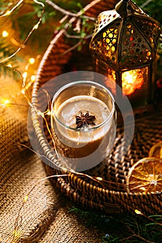 Coffee latte in a wicker basket tray with garland