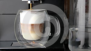 Closeup coffee machine process to make fresh latte