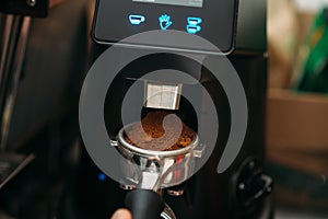 Closeup coffee machine in work.