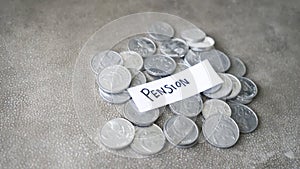 Closeup of coins with Pension text on table