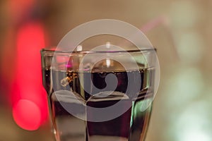 Closeup of coke in a transparent glass