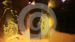 closeup of cold beer bottles with water drops